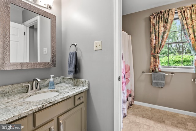 bathroom featuring vanity and tile patterned flooring