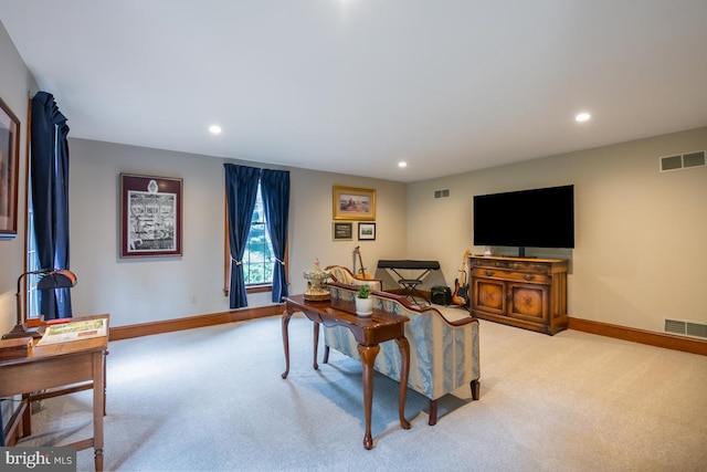 living room featuring light colored carpet