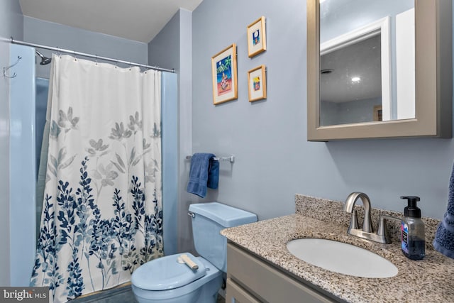 bathroom with vanity and toilet