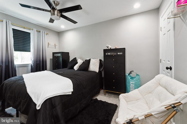 carpeted bedroom with ceiling fan