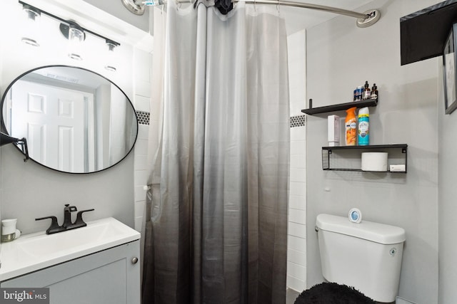 bathroom with toilet and vanity