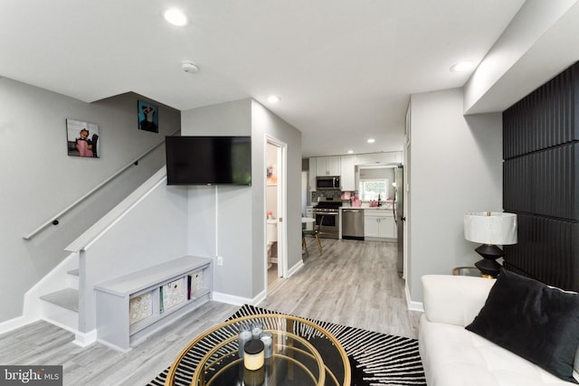 living room with light hardwood / wood-style flooring