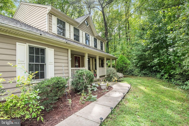 view of front of home featuring a front lawn and a porch