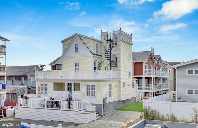 view of front of home featuring a balcony