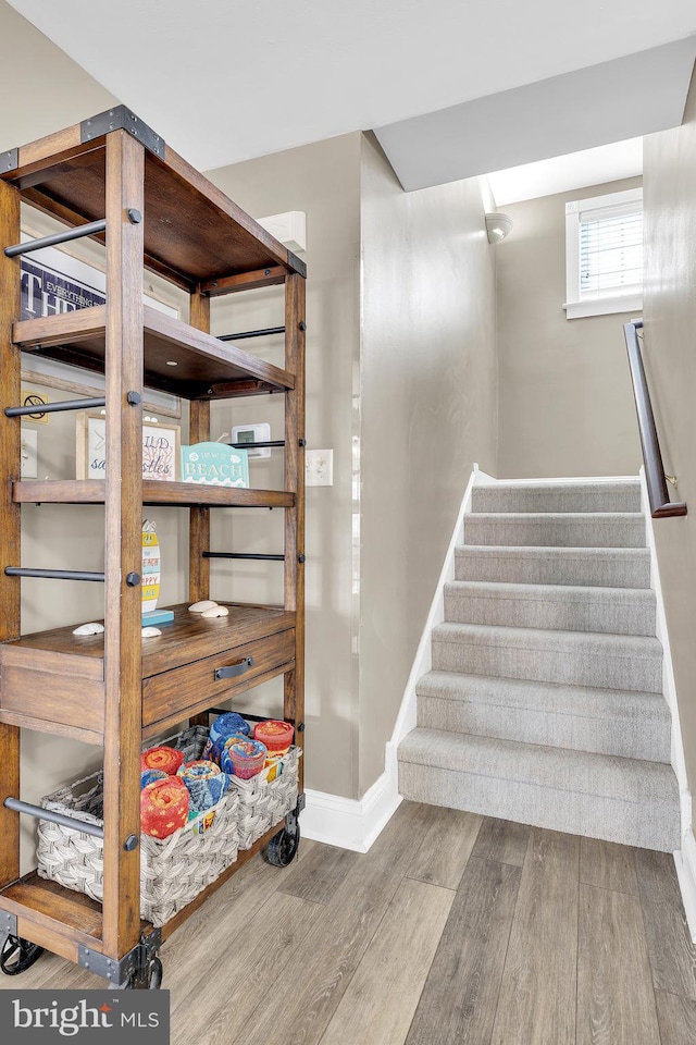 stairway featuring hardwood / wood-style flooring