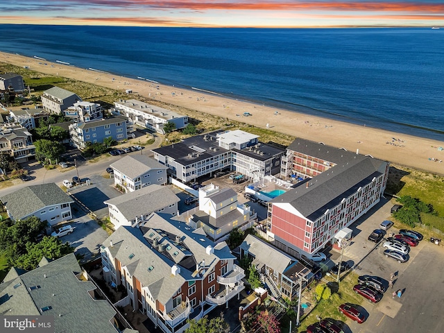 drone / aerial view with a water view and a view of the beach