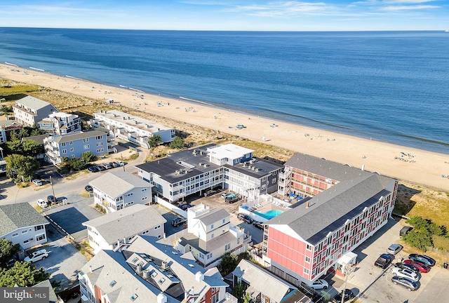 bird's eye view with a water view and a view of the beach