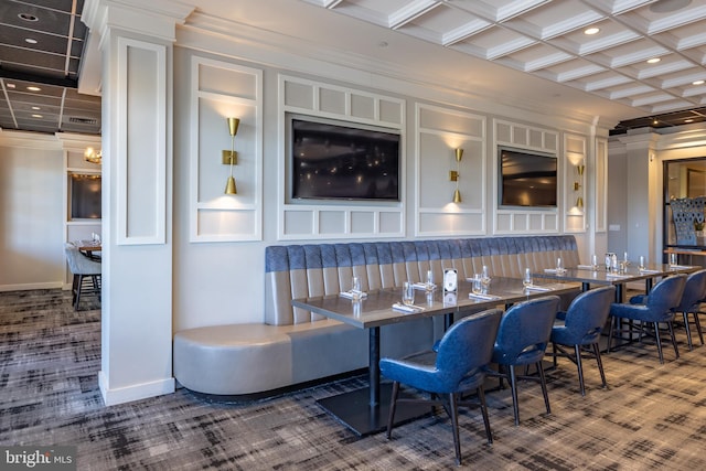 bar featuring beamed ceiling, carpet, coffered ceiling, and ornamental molding