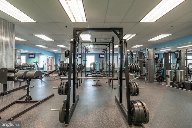 workout area featuring a paneled ceiling