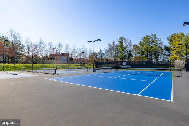 view of sport court with fence