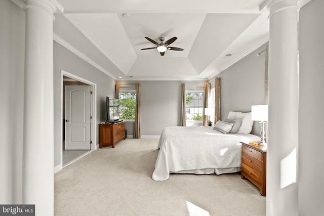 bedroom featuring a tray ceiling, baseboards, ornate columns, and light carpet