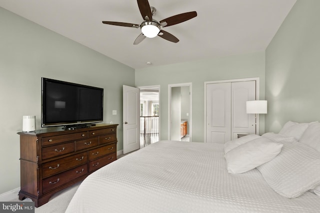 carpeted bedroom featuring a ceiling fan, a closet, and baseboards