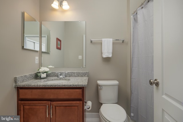 full bathroom featuring toilet and vanity