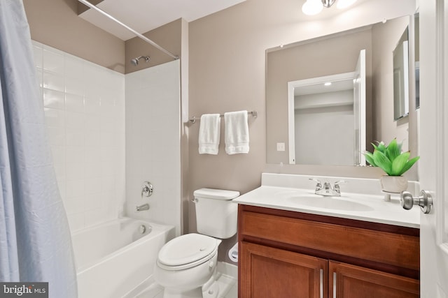 full bathroom with vanity, toilet, and shower / bath combo with shower curtain