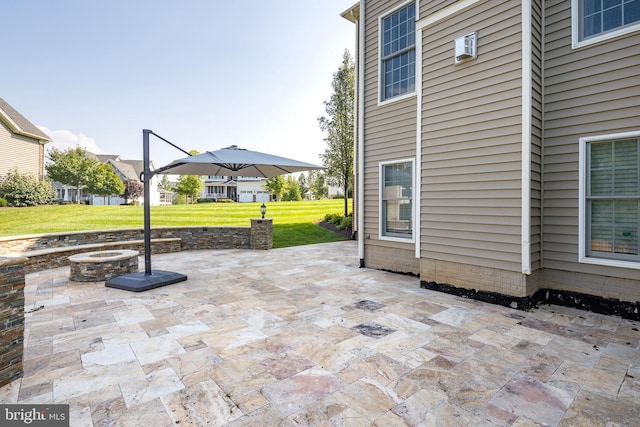 view of patio / terrace featuring an outdoor fire pit