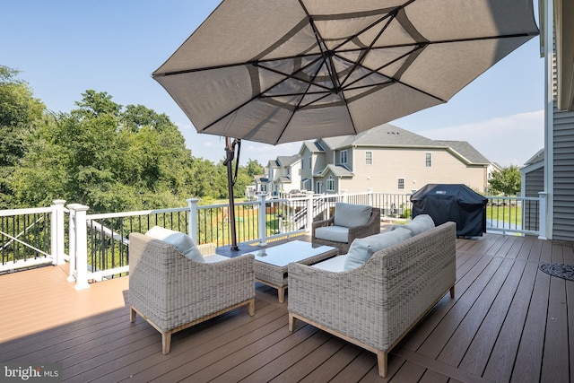 wooden deck with a residential view, an outdoor hangout area, and area for grilling