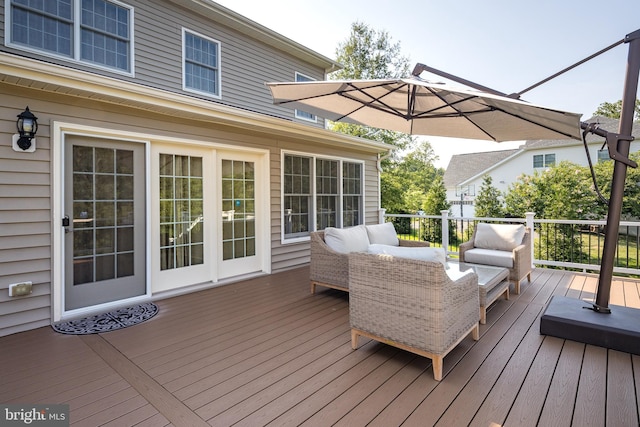 wooden deck with an outdoor living space