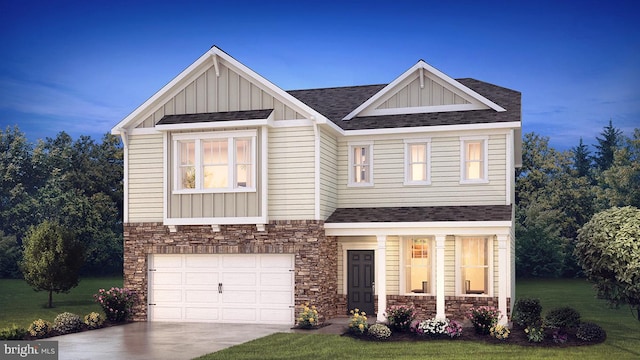 craftsman-style house featuring a front yard and a garage