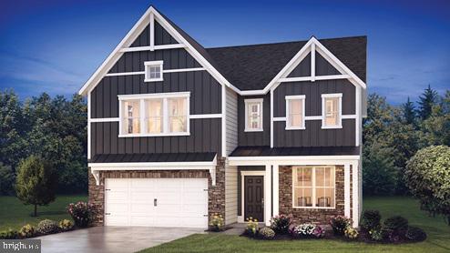 view of front facade featuring a garage and a front yard