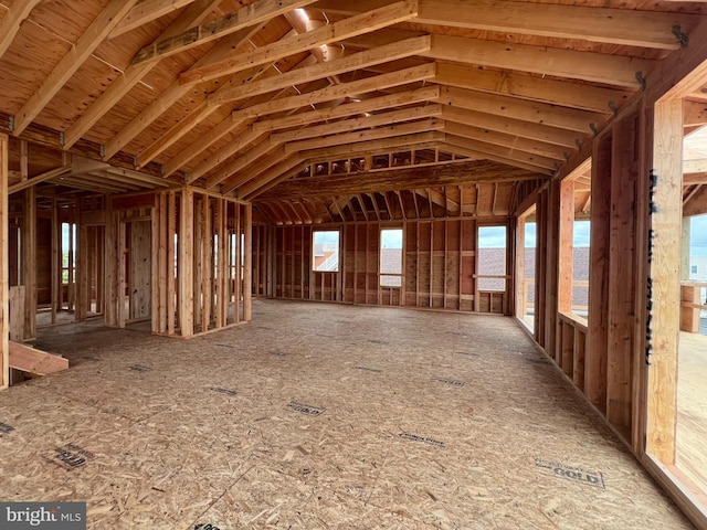 miscellaneous room with lofted ceiling