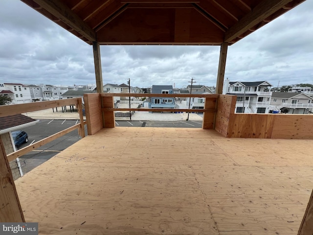 view of yard with a residential view and a balcony