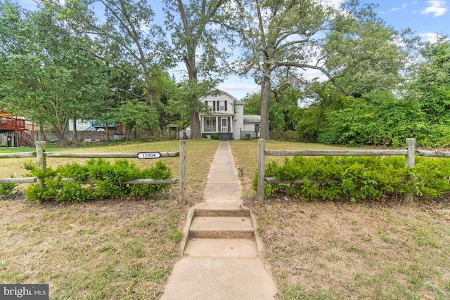 view of community featuring a yard