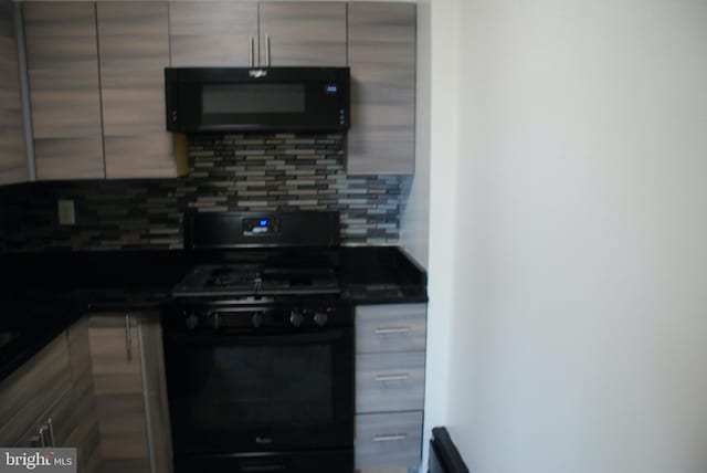 kitchen with tasteful backsplash and black appliances