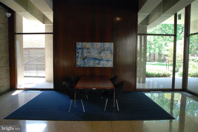 dining space with floor to ceiling windows