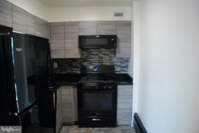 kitchen with decorative backsplash and black appliances