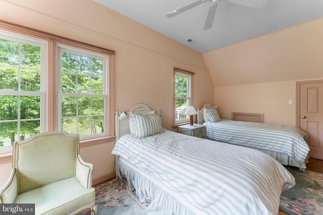 bedroom with ceiling fan and vaulted ceiling