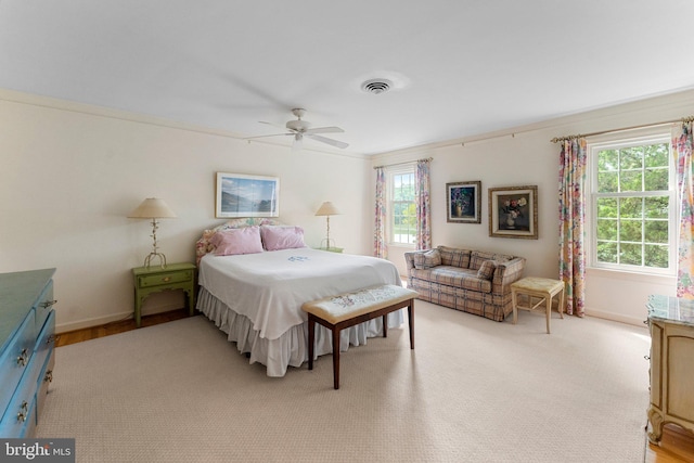 bedroom featuring light hardwood / wood-style floors and ceiling fan