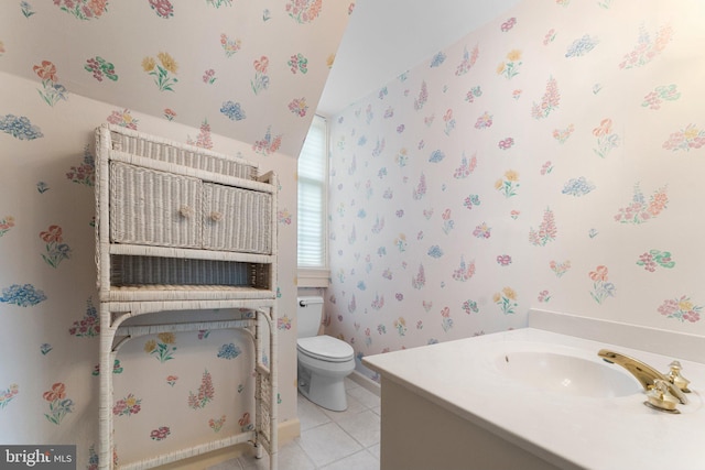 bathroom with tile patterned floors, vanity, and toilet