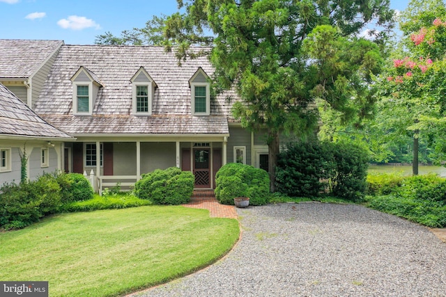 new england style home with a front lawn