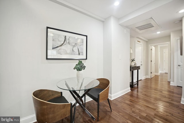 dining area with dark hardwood / wood-style flooring