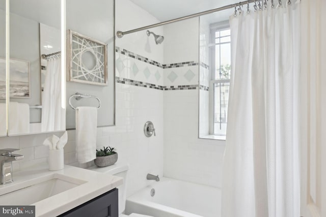 full bathroom with tasteful backsplash, vanity, toilet, and shower / bath combo with shower curtain