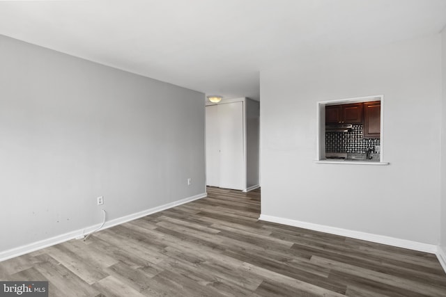 empty room featuring hardwood / wood-style flooring