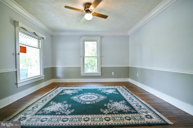 unfurnished room featuring crown molding, ceiling fan, hardwood / wood-style flooring, and a textured ceiling