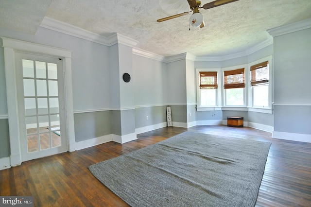 unfurnished room featuring ceiling fan, crown molding, dark hardwood / wood-style floors, and a textured ceiling