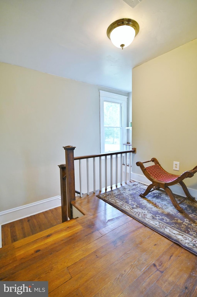 corridor featuring hardwood / wood-style floors