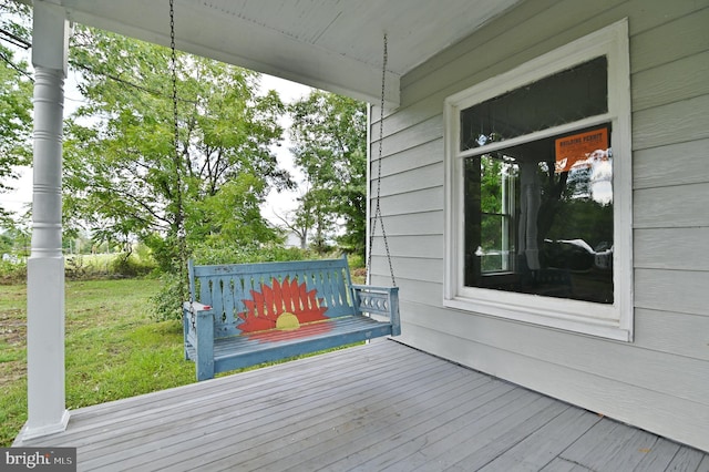 deck featuring a yard