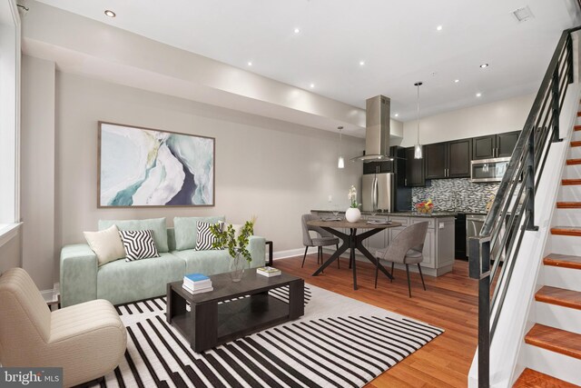 living room with light hardwood / wood-style flooring