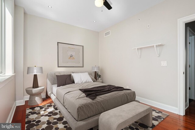 bedroom featuring ceiling fan and dark hardwood / wood-style floors