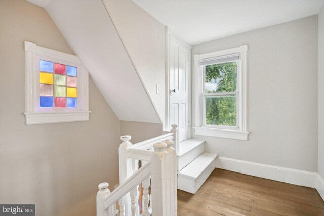 interior space featuring vaulted ceiling and light hardwood / wood-style flooring