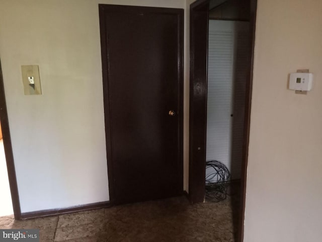 corridor with tile patterned flooring