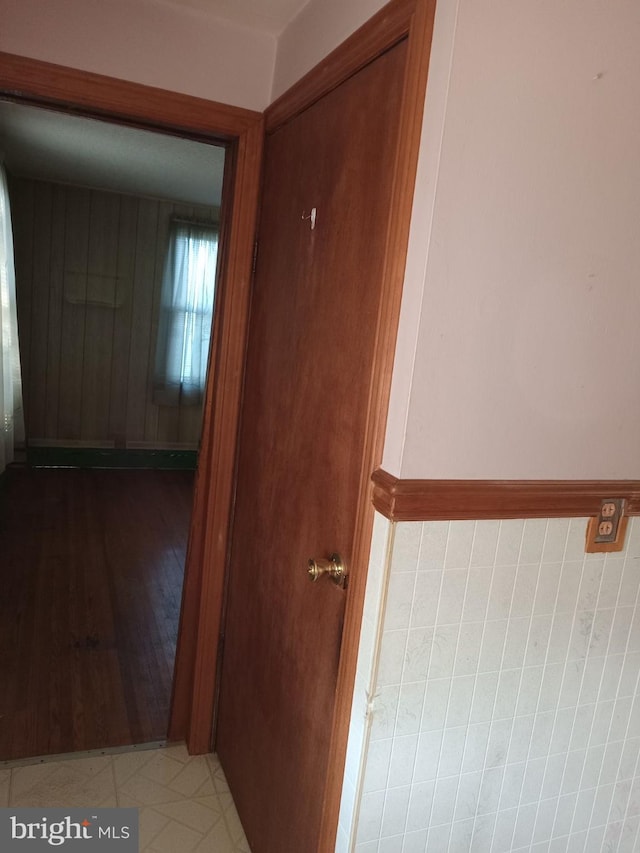 hallway with tile patterned floors