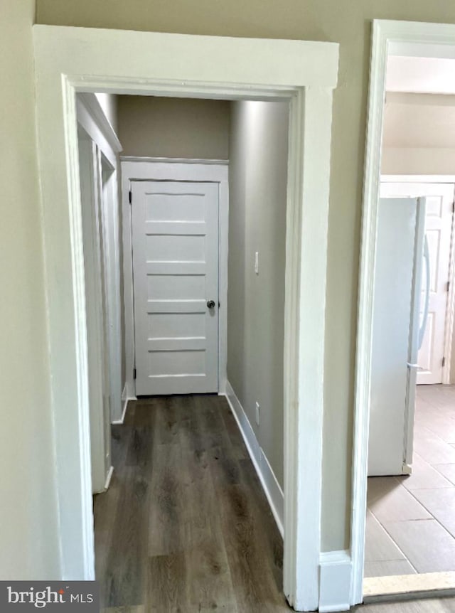 corridor featuring hardwood / wood-style flooring