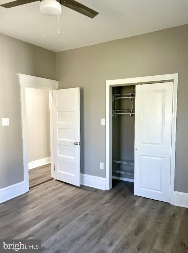 unfurnished bedroom with a closet, hardwood / wood-style floors, and ceiling fan