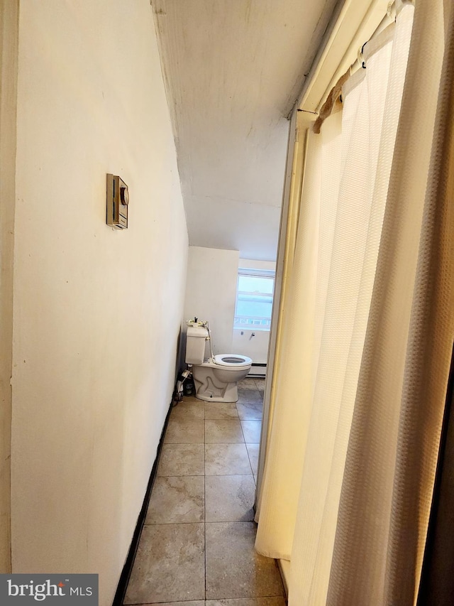 bathroom with tile patterned floors and toilet