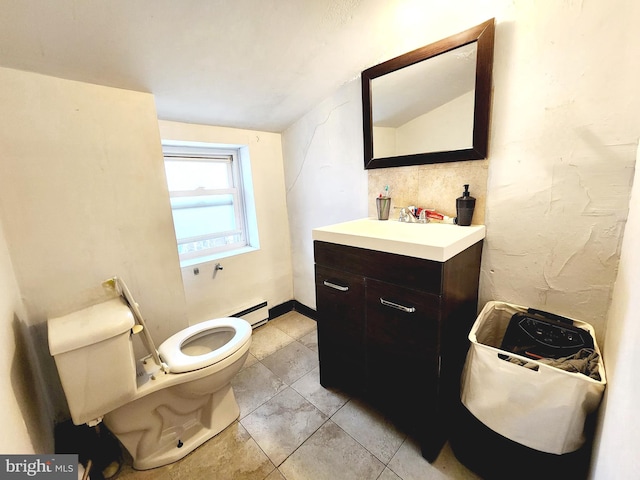 bathroom featuring vaulted ceiling, tile patterned flooring, toilet, vanity, and a baseboard heating unit