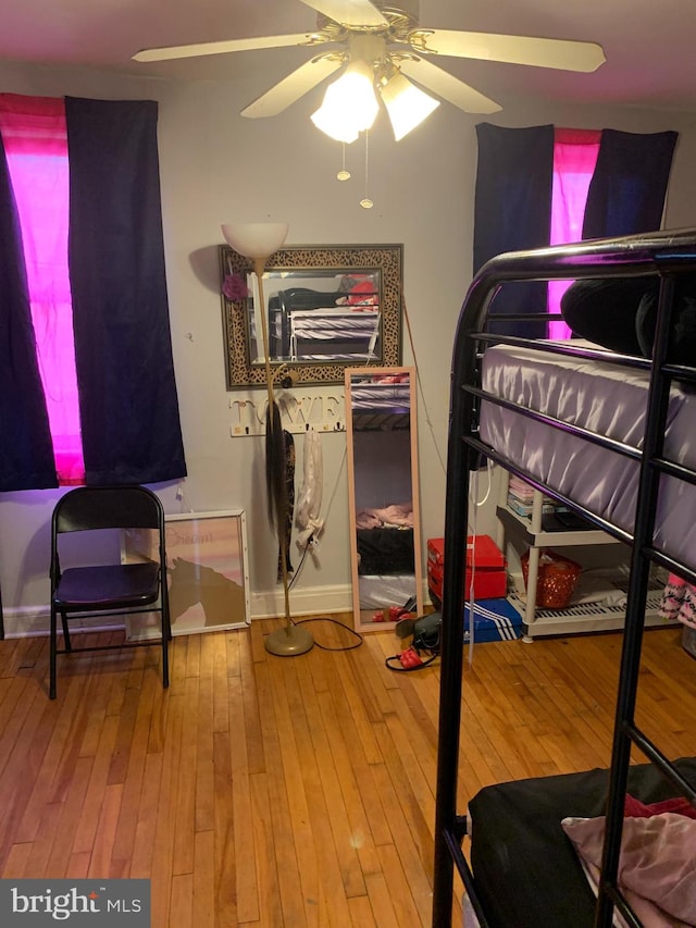 bedroom featuring ceiling fan and wood-type flooring